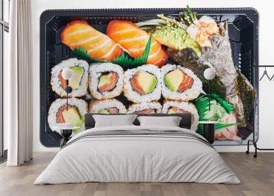  Delivery tray of delicious sushi over isolated white background Wall mural