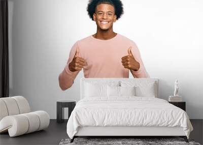 African american man with afro hair wearing casual clothes success sign doing positive gesture with hand, thumbs up smiling and happy. cheerful expression and winner gesture. Wall mural