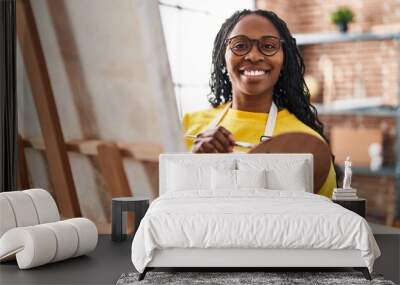 African american woman artist smiling confident drawing at art studio Wall mural