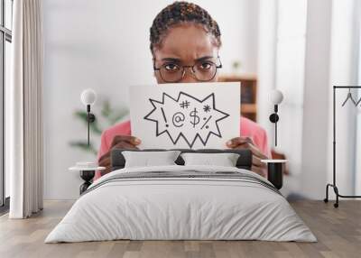 african american woman business worker holding insult banner at office Wall mural