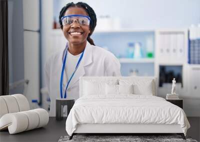 African american woman scientist smiling confident standing at laboratory Wall mural