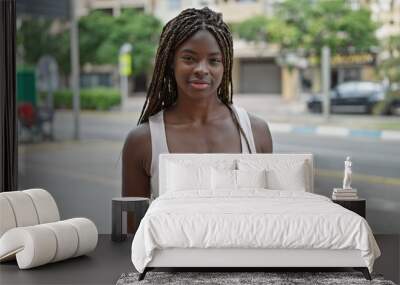 African american woman smiling confident standing at street Wall mural