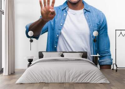 Afro american man over isolated background showing and pointing up with fingers number four while smiling confident and happy. Wall mural