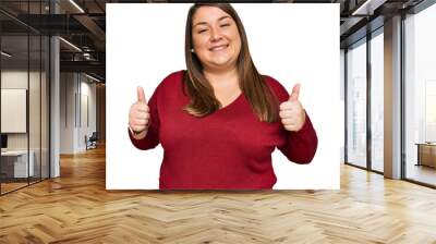 Beautiful brunette plus size woman wearing casual clothes success sign doing positive gesture with hand, thumbs up smiling and happy. cheerful expression and winner gesture. Wall mural