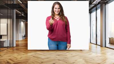 Beautiful plus size young woman over isolated background Beckoning come here gesture with hand inviting happy and smiling Wall mural