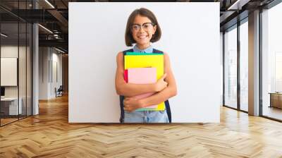 Beautiful student child girl wearing backpack glasses books over isolated white background with a happy face standing and smiling with a confident smile showing teeth Wall mural