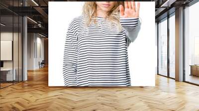 Beautiful young blonde woman wearing stripes sweater over isolated background doing stop sing with palm of the hand. Warning expression with negative and serious gesture on the face. Wall mural