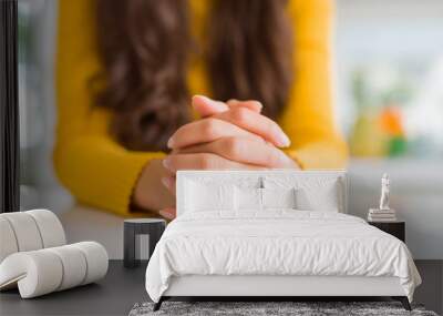 Close up of woman hands over white table Wall mural