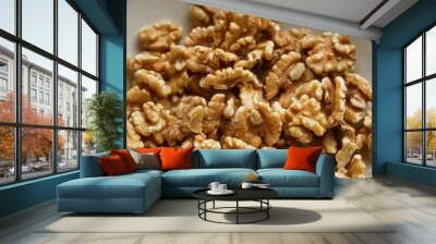 Closeup of shelled walnuts showcasing their texture and detail, highlighting the rich, brown color and healthy nutritional content Wall mural