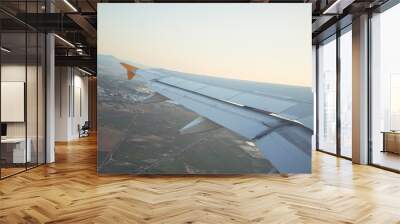 Cloudscape from window airplane, landscape of wing plane on a cloudy sky Wall mural