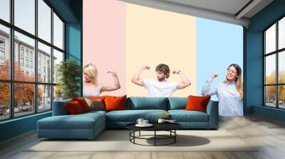 Collage of group of young people over colorful vintage isolated background showing arms muscles smiling proud. Fitness concept. Wall mural