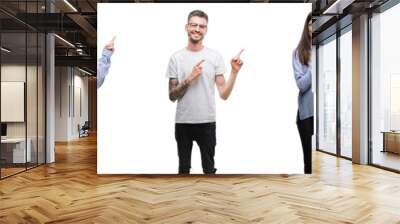 Group and team of young business people over isolated white background smiling and looking at the camera pointing with two hands and fingers to the side. Wall mural