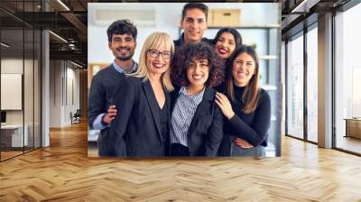 Group of business workers smiling happy and confident. Posing together with smile on face looking at the camera at the office Wall mural