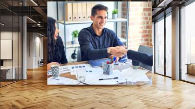 Group of business workers smiling happy and confident. Working together with smile on face shaking hands for agreement at the office Wall mural