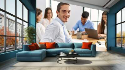 Group of business workers smiling happy working at the office. Wall mural