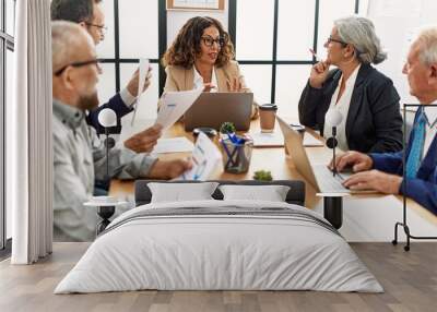 Group of middle age business workers smiling happy working at the office Wall mural