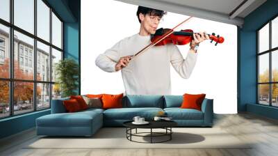 Handsome hipster young man playing violin making fish face with mouth and squinting eyes, crazy and comical. Wall mural