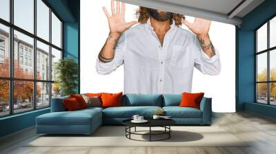 Handsome man with beard and long hair wearing casual clothes showing and pointing up with fingers number ten while smiling confident and happy. Wall mural