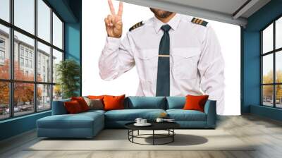 Handsome man with beard wearing airplane pilot uniform showing and pointing up with fingers number two while smiling confident and happy. Wall mural