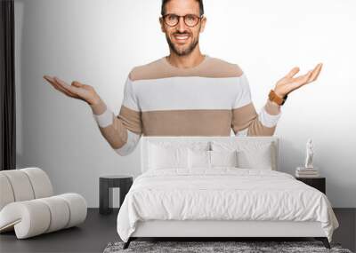 Handsome man with beard wearing casual clothes and glasses smiling showing both hands open palms, presenting and advertising comparison and balance Wall mural