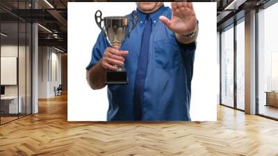 Handsome senior successful man holding trophy over isolated background with open hand doing stop sign with serious and confident expression, defense gesture Wall mural