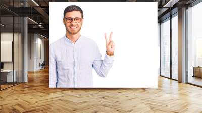 Handsome young man with bear wearing elegant business shirt and glasses showing and pointing up with fingers number two while smiling confident and happy. Wall mural