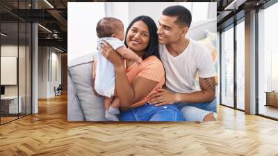 Hispanic family smiling confident sitting on sofa at home Wall mural