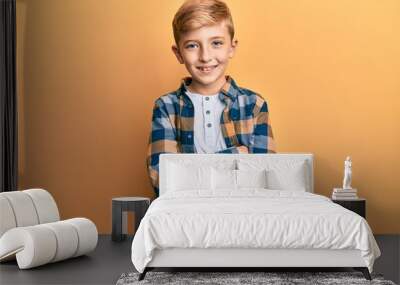 Little caucasian boy kid wearing casual clothes happy face smiling with crossed arms looking at the camera. positive person. Wall mural