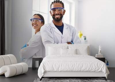 Man and woman scientist partners smiling confident standing with arms crossed gesture at laboratory Wall mural