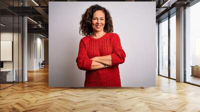 Middle age brunette woman wearing casual sweater standing over isolated white background happy face smiling with crossed arms looking at the camera. Positive person. Wall mural