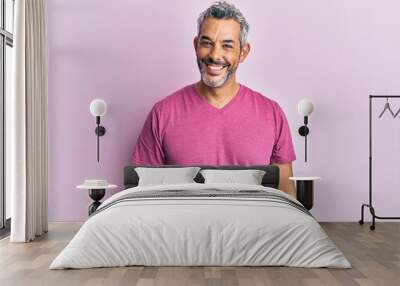 Middle age grey-haired man wearing casual clothes looking positive and happy standing and smiling with a confident smile showing teeth Wall mural