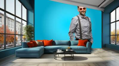 Middle age man, with beard and bow tie confident and happy with a big natural smile looking at camera Wall mural