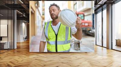 Middle age man architect sweating at street Wall mural