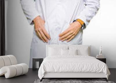 Middle age therapist wearing white coat with serious expression on face. Simple and natural looking at the camera. Wall mural