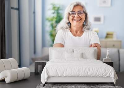 Middle age woman smiling confident standing with arms crossed gesture at home Wall mural