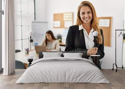 Mother and daughter business workers smiling confident standing with arms crossed gesture at office Wall mural