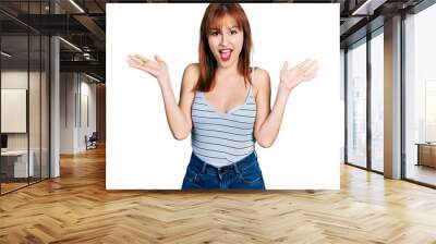 Redhead young woman wearing casual style with sleeveless shirt celebrating victory with happy smile and winner expression with raised hands Wall mural