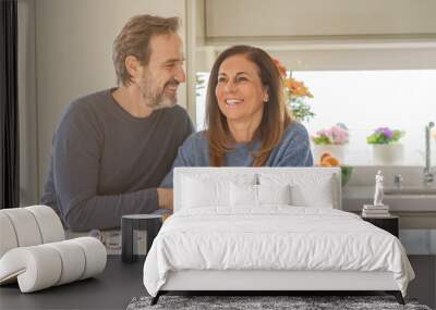 Romantic middle age couple sitting together at home Wall mural