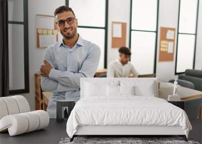 Two hispanic men business workers standing with arms crossed gesture at office Wall mural