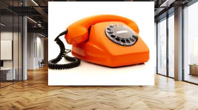 Vintage orange telephone over white background Wall mural