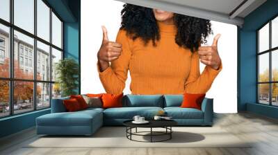 Young african american girl wearing casual clothes success sign doing positive gesture with hand, thumbs up smiling and happy. cheerful expression and winner gesture. Wall mural