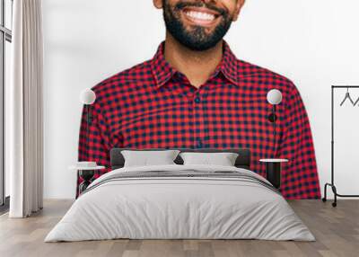 Young african american man wearing casual clothes looking positive and happy standing and smiling with a confident smile showing teeth Wall mural