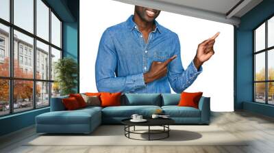 Young african american man wearing casual clothes smiling and looking at the camera pointing with two hands and fingers to the side. Wall mural