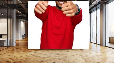 Young african american man with beard wearing casual winter sweater approving doing positive gesture with hand, thumbs up smiling and happy for success. winner gesture. Wall mural