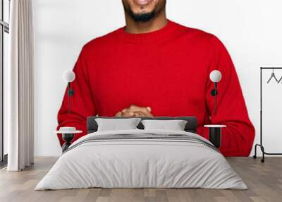 Young african american man with beard wearing casual winter sweater with hands together and crossed fingers smiling relaxed and cheerful. success and optimistic Wall mural