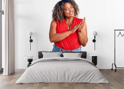 Young african american plus size woman wearing casual style with sleeveless shirt clapping and applauding happy and joyful, smiling proud hands together Wall mural