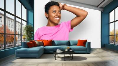 Young african american woman wearing casual clothes smiling confident touching hair with hand up gesture, posing attractive and fashionable Wall mural