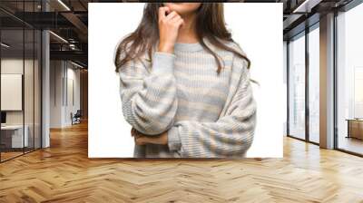 Young beautiful arab woman wearing winter sweater over isolated background with hand on chin thinking about question, pensive expression. Smiling with thoughtful face. Doubt concept. Wall mural