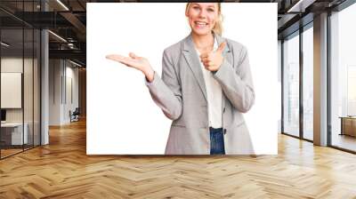 Young beautiful blonde woman wearing elegant jacket showing palm hand and doing ok gesture with thumbs up, smiling happy and cheerful Wall mural