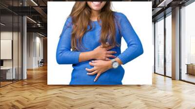 Young beautiful brunette woman wearing blue sweater over isolated background Smiling and laughing hard out loud because funny crazy joke. Happy expression. Wall mural